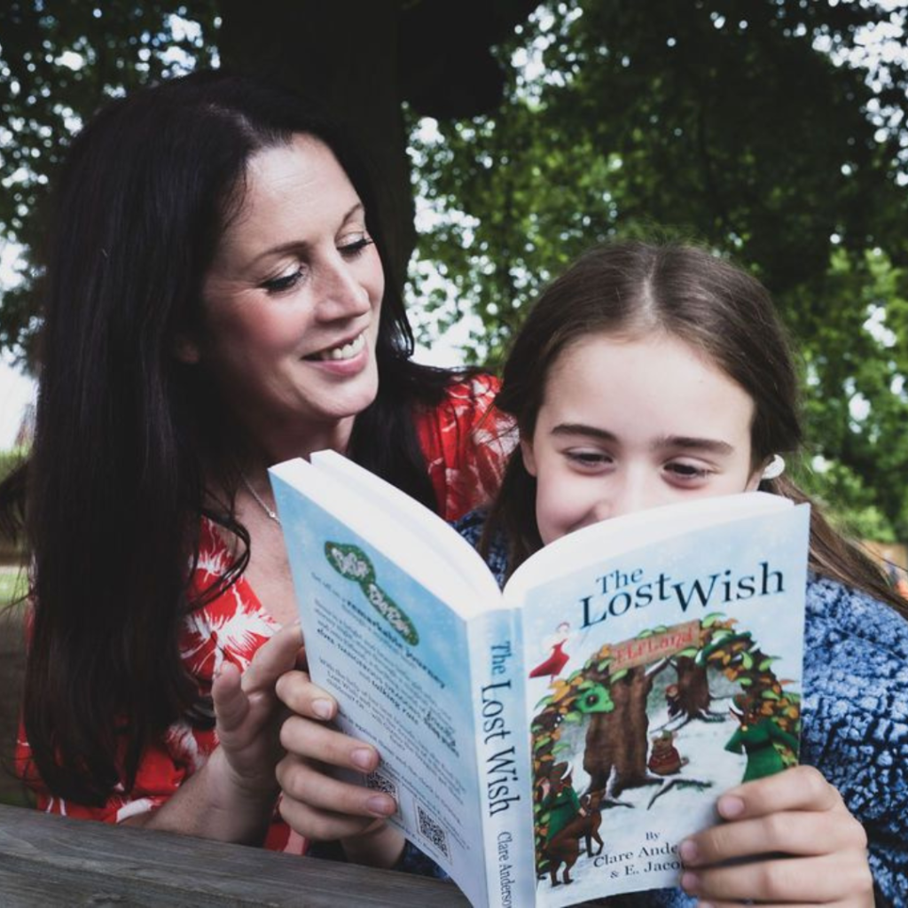 Clare Anderson and Daughter Siena Reading The Lost Wish Book Outside