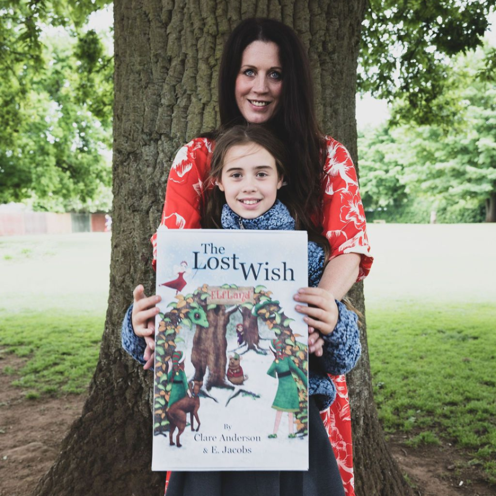 Clare Anderson and Daughter Siena with The Lost Wish Book Outside